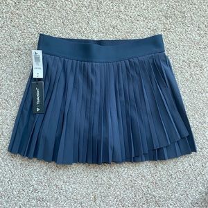 BNWT TNA Aritzia Love Navy Tennis Skirt with hidden shorts with pockets